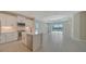Modern kitchen with stainless steel appliances and white cabinets at 14631 Barefoot Ln, Parrish, FL 34219