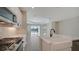 Open kitchen with island, quartz countertops and stainless steel appliances at 14631 Barefoot Ln, Parrish, FL 34219
