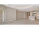 Spacious living room with tile floors and access to other rooms at 14631 Barefoot Ln, Parrish, FL 34219