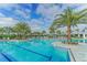 Large community pool with lap lanes and ample seating at 14631 Barefoot Ln, Parrish, FL 34219
