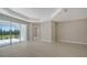 Bright living room with sliding glass doors leading to backyard at 14631 Barefoot Ln, Parrish, FL 34219