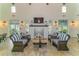 Relaxing community room featuring a fireplace and comfortable seating at 14631 Barefoot Ln, Parrish, FL 34219
