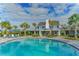 Resort-style pool with lounge chairs and clubhouse at 14631 Barefoot Ln, Parrish, FL 34219
