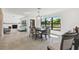 Open concept dining room with a view into the living room and kitchen at 301 Aurora E St, Venice, FL 34285