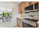 Modern kitchen with stainless steel appliances and light wood cabinets at 301 Aurora E St, Venice, FL 34285
