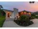 Modern home with clean lines and attractive landscaping at 301 Aurora E St, Venice, FL 34285