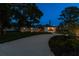 Landscaped front yard with modern home at dusk at 301 Aurora E St, Venice, FL 34285