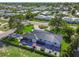 Luxury home with a large backyard, patio, and hot tub at 301 Aurora E St, Venice, FL 34285