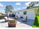 Relaxing patio with fire pit and comfortable seating at 301 Aurora E St, Venice, FL 34285