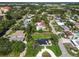 An aerial view of a contemporary home nestled in a quiet neighborhood at 301 Aurora E St, Venice, FL 34285
