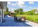 Spacious backyard with patio furniture and lush green space at 301 Aurora E St, Venice, FL 34285