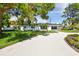 Modern home with a white exterior and a landscaped yard at 301 Aurora E St, Venice, FL 34285