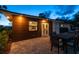 Backyard patio features modern furniture and lighting at 301 Aurora E St, Venice, FL 34285