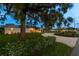 Landscaped front yard with modern home and driveway at 301 Aurora E St, Venice, FL 34285