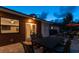 Relaxing patio with table and chairs at night at 301 Aurora E St, Venice, FL 34285