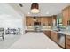 Modern kitchen with breakfast bar, stainless steel appliances, and dining area view at 301 Aurora E St, Venice, FL 34285