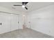 Bright bedroom with ceiling fan and access to hallway at 301 Aurora E St, Venice, FL 34285