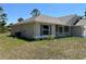 This is a well-maintained home with shutters, a concrete foundation, and a manicured lawn at 4012 Oscar Ter, North Port, FL 34286