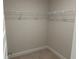 Spacious walk-in closet equipped with wire shelving for organized storage at 4012 Oscar Ter, North Port, FL 34286