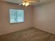 Bright bedroom with carpet flooring and ceiling fan at 4540 Tippecanoe Trl # 183, Sarasota, FL 34233