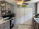 Bright kitchen with stainless steel appliances and wood cabinets at 4540 Tippecanoe Trl # 183, Sarasota, FL 34233