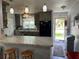 Updated kitchen with breakfast bar and access to the patio at 4540 Tippecanoe Trl # 183, Sarasota, FL 34233