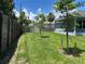 Picture of the large backyard with green grass and newly planted trees at 4860 Florida Rd, Venice, FL 34293