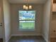 Inviting dining area featuring a modern chandelier and a large window at 4860 Florida Rd, Venice, FL 34293