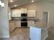Beautiful kitchen with stainless steel appliances, granite countertops, and white cabinets at 4860 Florida Rd, Venice, FL 34293