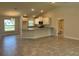 Modern kitchen featuring a large island, stainless steel appliances, and ample counter space at 4860 Florida Rd, Venice, FL 34293