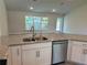 The modern kitchen includes a stainless steel dishwasher, granite countertops, and a breakfast bar at 4860 Florida Rd, Venice, FL 34293