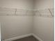 Walk-in closet offers ample storage space with wire shelving on every wall at 4860 Florida Rd, Venice, FL 34293