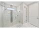 Large walk-in shower with glass enclosure and marble tile at 5244 Barnett Cir, Lakewood Ranch, FL 34211