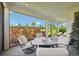 Spacious covered patio with seating area and a view of the backyard at 5244 Barnett Cir, Lakewood Ranch, FL 34211