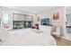 Bright bedroom with large windows, dresser, and comfortable seating at 5244 Barnett Cir, Lakewood Ranch, FL 34211