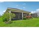 Spacious screened patio with lush landscaping, perfect for relaxing outdoors at 5244 Barnett Cir, Lakewood Ranch, FL 34211