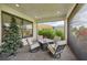 Covered patio with seating area and fire pit, perfect for outdoor entertaining at 5244 Barnett Cir, Lakewood Ranch, FL 34211