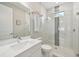 Clean bathroom with a single vanity, toilet and a walk-in shower at 5244 Barnett Cir, Lakewood Ranch, FL 34211