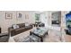 Living area features stylish seating and access to home office at 5244 Barnett Cir, Lakewood Ranch, FL 34211