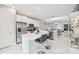 Open concept kitchen with island, stainless steel appliances, and view to living area at 5244 Barnett Cir, Lakewood Ranch, FL 34211