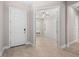 Bright entryway with view into bedroom with murphy bed at 6600 Dovekey Dr, Sarasota, FL 34241
