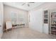 Charming bedroom with a murphy bed and plenty of storage at 6600 Dovekey Dr, Sarasota, FL 34241