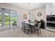 Kitchen dining area with glass table and view of backyard at 6600 Dovekey Dr, Sarasota, FL 34241