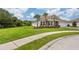 Single-story home with landscaped yard, driveway, and two-car garage at 6600 Dovekey Dr, Sarasota, FL 34241