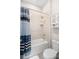Bathroom with shower/tub combo and striped shower curtain at 6600 Dovekey Dr, Sarasota, FL 34241