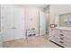 Spacious bedroom with double doors and built-in shelving at 6600 Dovekey Dr, Sarasota, FL 34241