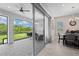 Covered patio with view of backyard, accessible from dining area at 6600 Dovekey Dr, Sarasota, FL 34241