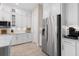 Modern kitchen with stainless steel appliances and white cabinetry at 6600 Dovekey Dr, Sarasota, FL 34241