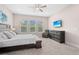 Main bedroom with a king-size bed and TV at 6600 Dovekey Dr, Sarasota, FL 34241
