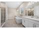 Bathroom with double vanity, soaking tub and shower at 6600 Dovekey Dr, Sarasota, FL 34241